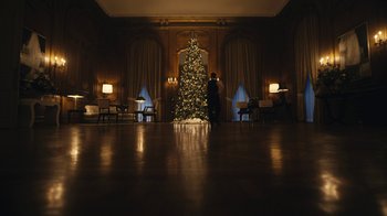 Movie still from “Mr. Robot” (2015), created by Sam Esmail – A person standing in front of a christmas tree in a room; Extreme Wide shot, Low angle