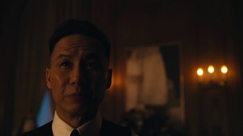 Movie still from “Mr. Robot” (2015), created by Sam Esmail – A person wearing a suit and tie; Close Up shot, Over the shoulder angle