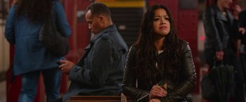 Movie still from “Someone Great” (2019), directed by Jennifer Kaytin Robinson – A woman sitting in front of a man in front of a bench; Medium shot, Over the shoulder angle