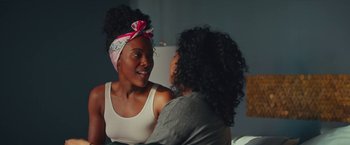 Movie still from “Someone Great” (2019), directed by Jennifer Kaytin Robinson – Two women talking to each other in front of a refrigerator; Close Up shot, Over the shoulder angle