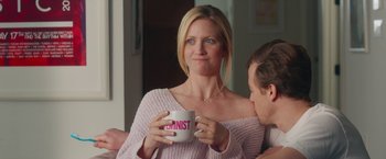 Movie still from “Someone Great” (2019), directed by Jennifer Kaytin Robinson – A woman is holding a feminist coffee mug; Medium shot, Over the shoulder angle