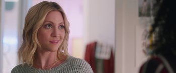 Movie still from “Someone Great” (2019), directed by Jennifer Kaytin Robinson – A person smiling at the camera; Close Up shot, Over the shoulder angle