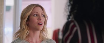 Movie still from “Someone Great” (2019), directed by Jennifer Kaytin Robinson – A blonde woman looking up at something in the distance; Close Up shot, Over the shoulder angle