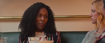 Movie still from “Someone Great” (2019), directed by Jennifer Kaytin Robinson – A person sitting on a couch; Close Up shot, Over the shoulder angle