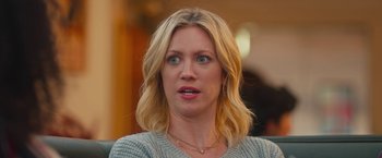 Movie still from “Someone Great” (2019), directed by Jennifer Kaytin Robinson – A woman with blonde hair and blue eyes looking at the camera; Close Up shot, Over the shoulder angle