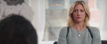 Movie still from “Someone Great” (2019), directed by Jennifer Kaytin Robinson – A woman sitting in front of a window; Close Up shot, Over the shoulder angle