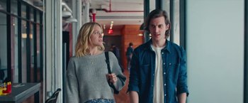 Movie still from “Someone Great” (2019), directed by Jennifer Kaytin Robinson – A man and a woman walking down a hall way; Medium shot, Over the shoulder angle