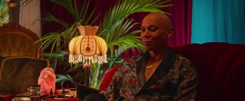 Movie still from “Someone Great” (2019), directed by Jennifer Kaytin Robinson – A man sitting in front of a lamp in a living room; Medium shot, High angle