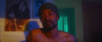 Movie still from “Someone Great” (2019), directed by Jennifer Kaytin Robinson – A man with a beard wearing a beanie; Close Up shot, Over the shoulder angle