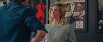 Movie still from “Someone Great” (2019), directed by Jennifer Kaytin Robinson – A woman in a gray sweater is looking at a man; Medium shot, Over the shoulder angle