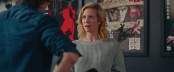 Movie still from “Someone Great” (2019), directed by Jennifer Kaytin Robinson – A woman in a gray sweater is looking at a man; Medium shot, Over the shoulder angle