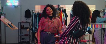 Movie still from “Someone Great” (2019), directed by Jennifer Kaytin Robinson – A woman standing next to another woman in a clothing store; Medium shot, Over the shoulder angle