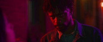 Movie still from “Someone Great” (2019), directed by Jennifer Kaytin Robinson – A person wearing a jacket; Close Up shot, Over the shoulder angle