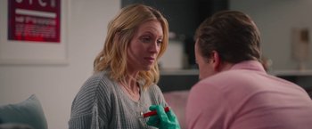 Movie still from “Someone Great” (2019), directed by Jennifer Kaytin Robinson – A woman is holding something in her hand while talking to another woman; Close Up shot, Over the shoulder angle