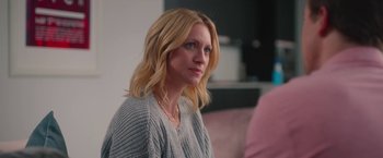 Movie still from “Someone Great” (2019), directed by Jennifer Kaytin Robinson – A woman sitting on a couch looking to her left; Close Up shot, Over the shoulder angle