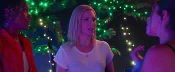 Movie still from “Someone Great” (2019), directed by Jennifer Kaytin Robinson – A woman with blonde hair standing in front of a christmas tree; Medium shot, Over the shoulder angle