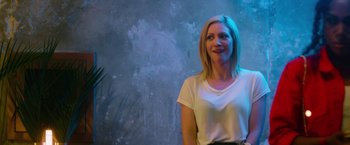 Movie still from “Someone Great” (2019), directed by Jennifer Kaytin Robinson – A woman standing in front of a wall; Medium shot, Over the shoulder angle