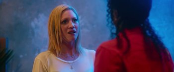 Movie still from “Someone Great” (2019), directed by Jennifer Kaytin Robinson – A woman talking to another woman in a room; Close Up shot, Over the shoulder angle