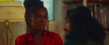 Movie still from “Someone Great” (2019), directed by Jennifer Kaytin Robinson – A woman in a red shirt is talking to another woman; Close Up shot, Over the shoulder angle
