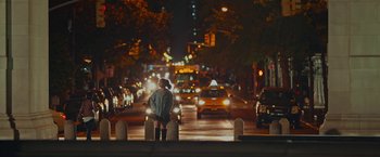 Movie still from “Someone Great” (2019), directed by Jennifer Kaytin Robinson – A woman sitting on a bench on the side of the road; Wide shot, Over the shoulder angle