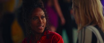 Movie still from “Someone Great” (2019), directed by Jennifer Kaytin Robinson – A person wearing a red shirt; Close Up shot, Over the shoulder angle