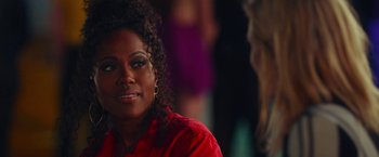 Movie still from “Someone Great” (2019), directed by Jennifer Kaytin Robinson – A person wearing a red shirt; Close Up shot, Over the shoulder angle