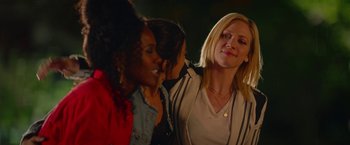 Movie still from “Someone Great” (2019), directed by Jennifer Kaytin Robinson – A group of women standing next to each other; Medium shot, Over the shoulder angle