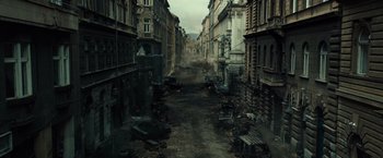 Movie still from “Spectral” (2016), directed by Nic Mathieu – An alley with a lot of trash on the ground; Extreme Wide shot, High angle