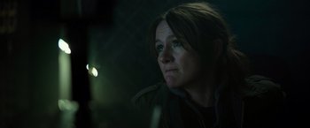 Movie still from “Spectral” (2016), directed by Nic Mathieu – A person looking at the camera; Close Up shot, Over the shoulder angle