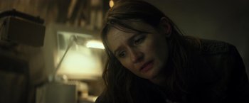 Movie still from “Spectral” (2016), directed by Nic Mathieu – A person with her head down; Close Up shot, Low angle