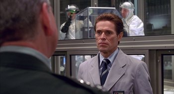 Movie still from “Spider-Man” (2002), directed by Sam Raimi – A man wearing a suit and tie in front of another man; Close Up shot, Over the shoulder angle