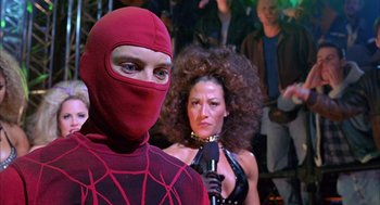 Movie still from “Spider-Man” (2002), directed by Sam Raimi – A man in a spider - man costume and a woman in a black outfit; Close Up shot, Over the shoulder angle