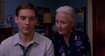Movie still from “Spider-Man” (2002), directed by Sam Raimi – An older woman and a younger man look at the camera; Close Up shot, Over the shoulder angle