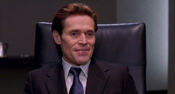 Movie still from “Spider-Man” (2002), directed by Sam Raimi – A person wearing a suit and tie; Close Up shot, Over the shoulder angle