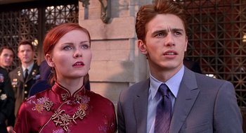 Movie still from “Spider-Man” (2002), directed by Sam Raimi – A man and a woman standing next to each other; Close Up shot, Low angle