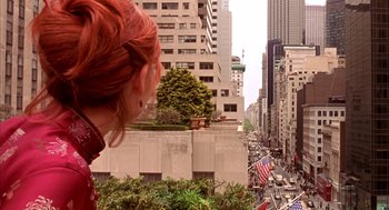 Movie still from “Spider-Man” (2002), directed by Sam Raimi – A woman looking out over a street in a large city; Extreme Wide shot, High angle