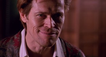 Movie still from “Spider-Man” (2002), directed by Sam Raimi – A person wearing a shirt and tie; Close Up shot, Low angle