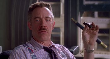 Movie still from “Spider-Man” (2002), directed by Sam Raimi – A person wearing a shirt and a tie; Close Up shot, Over the shoulder angle