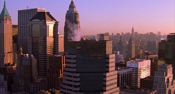 Movie still from “Spider-Man” (2002), directed by Sam Raimi – A view of a city skyline at sunset; Extreme Wide shot, High angle