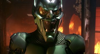 Movie still from “Spider-Man” (2002), directed by Sam Raimi – A person wearing a metal helmet; Close Up shot, Low angle