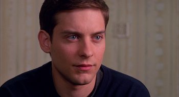 Movie still from “Spider-Man” (2002), directed by Sam Raimi – A person with blue eyes; Close Up shot, Over the shoulder angle