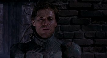 Movie still from “Spider-Man” (2002), directed by Sam Raimi – A person wearing a suit of armor; Close Up shot, Low angle