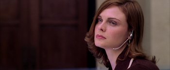 Movie still from “Spider-Man 2” (2004), directed by Sam Raimi – A person wearing a headset; Close Up shot, Low angle