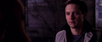Movie still from “Spider-Man 2” (2004), directed by Sam Raimi – A person wearing a jacket; Close Up shot, Over the shoulder angle