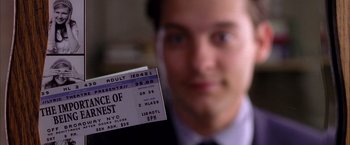 Movie still from “Spider-Man 2” (2004), directed by Sam Raimi – A person holding a ticket; Extreme Close Up shot, Overhead angle