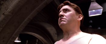 Movie still from “Spider-Man 2” (2004), directed by Sam Raimi – The face of a statue of a man; Close Up shot, Low angle
