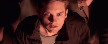 Movie still from “Spider-Man 2” (2004), directed by Sam Raimi – A person wearing a black jacket; Close Up shot, Low angle