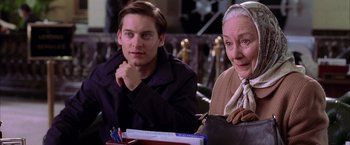 Movie still from “Spider-Man 2” (2004), directed by Sam Raimi – A man and a woman sitting next to each other; Close Up shot, Over the shoulder angle