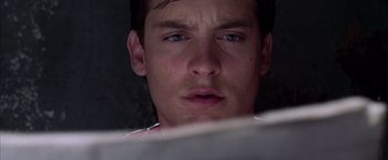 Movie still from “Spider-Man 2” (2004), directed by Sam Raimi – A person looking at a computer screen; Close Up shot, Low angle