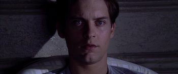 Movie still from “Spider-Man 2” (2004), directed by Sam Raimi – A person with a cigarette in his mouth; Close Up shot, High angle